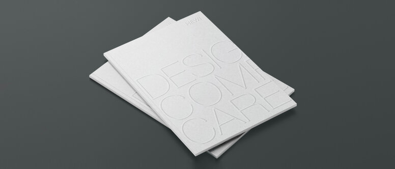 Design Comfort Care Dwie ułożone w stos broszury oznaczone jako Design Comfort Care